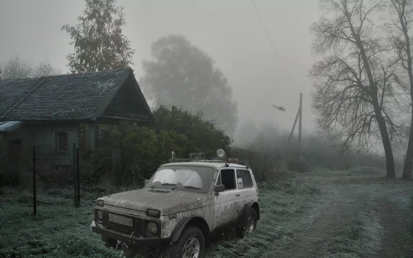 HD PC desktop wallpaper featuring a foggy, abandoned rural scene with a weathered vehicle, inspired by the video game S.T.A.L.K.E.R.: Shadow of Chernobyl.