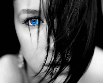 HD desktop wallpaper of a woman with striking blue eye and dark hair partially covering her face.