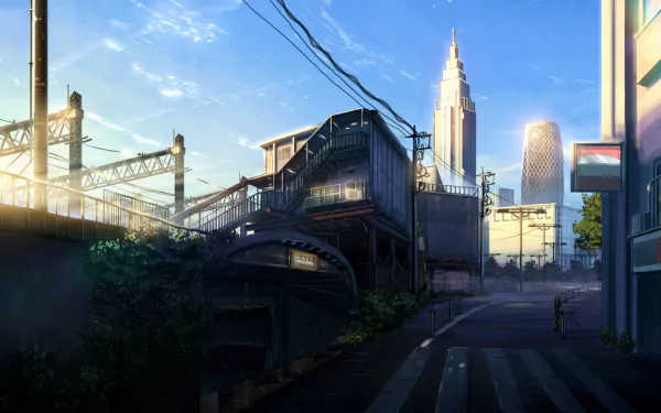 An anime-style cityscape featuring skyscrapers under a clear sky with clouds. Sunlight illuminates the landscape, creating a vivid and atmospheric HD wallpaper.