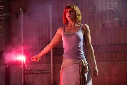 Bryce Dallas Howard holds a flare in a dramatic scene from Jurassic World, captured in stunning 4K Ultra HD for an engaging desktop wallpaper.