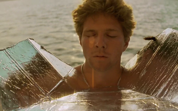 A serene moment from Apocalypse Now, featuring a man at peace, partially submerged in water, reflecting the film's intense themes. A striking HD desktop wallpaper.