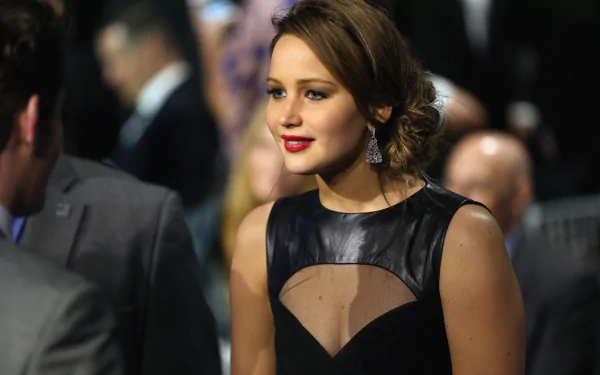 4K Ultra HD desktop wallpaper featuring celebrity Jennifer Lawrence in an elegant black dress with red lipstick at a formal event.