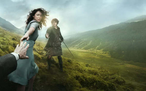 Claire and Jamie Fraser, portrayed by Caitriona Balfe and Sam Heughan, stand together in a dramatic landscape from the TV show *Outlander*, framed by lush green hills and a moody sky.