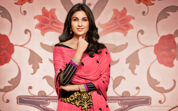A stunning HD desktop wallpaper featuring Parineeti Chopra in a vibrant pink outfit, elegantly posed against a floral backdrop, showcasing her grace and charm.
