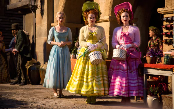Scene from the 2015 movie Cinderella featuring Lily James and two other women in colorful period dresses, captured in a 4K Ultra HD desktop wallpaper.