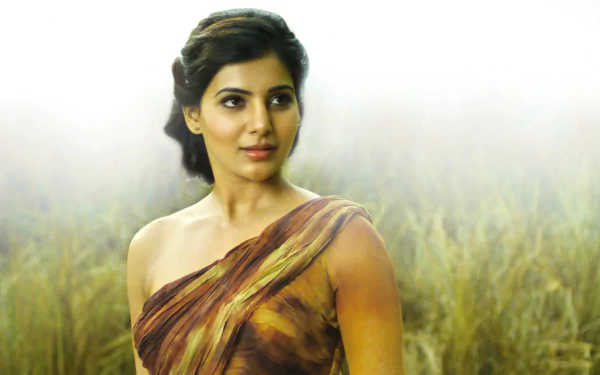 HD desktop wallpaper and background featuring celebrity Samantha Akkineni in an elegant dress, standing against a serene, misty field backdrop.