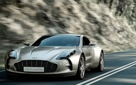 Stunning HD desktop wallpaper showcasing an Aston Martin One-77 in motion. The sleek design and dynamic scenery highlight the luxury and performance of this remarkable vehicle.