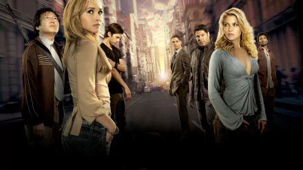 HD desktop wallpaper for the TV show Heroes showing the ensemble cast standing down an empty city street under dramatic, sunset-lit skies.