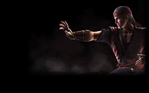 Liu Kang from Mortal Kombat X is captured in a dynamic pose against a dark background, showcasing his martial arts prowess in this HD desktop wallpaper.