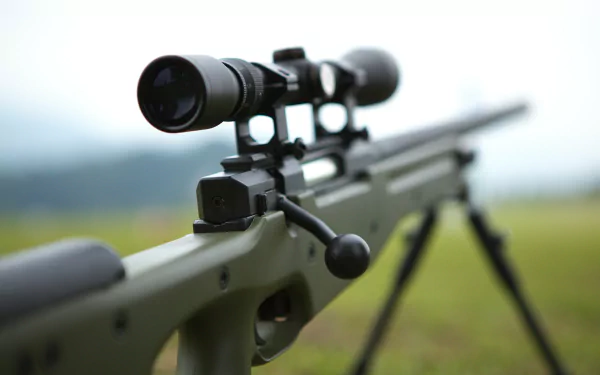 Close-up of a man-made rifle with a scope, captured in 4K Ultra HD as a detailed PC desktop wallpaper and background.