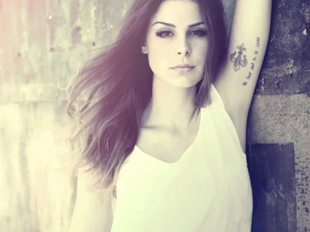 HD desktop wallpaper featuring Lena Meyer-Landrut with flowing hair and visible tattoos, evoking a soft, artistic vibe connected to music.