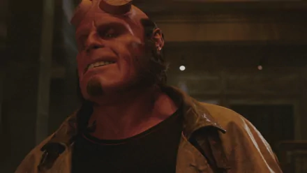 HD desktop wallpaper and background featuring Ron Perlman as Hellboy from the 2004 movie Hellboy. The character is depicted with his distinctive red skin and horns.