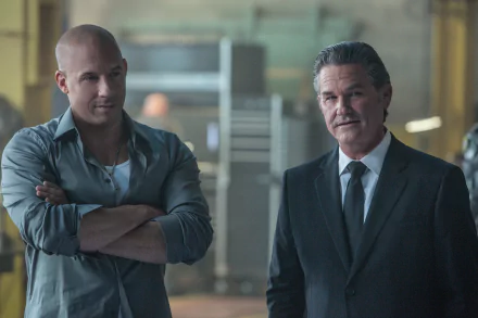 Kurt Russell as Mr. Nobody and Vin Diesel as Dominic Toretto in a scene from Furious 7, showcasing their dynamic in this high-energy action movie. HD desktop wallpaper.