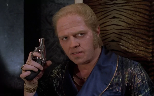 HD desktop wallpaper featuring a scene from the movie Back To The Future Part II, showing a character holding a futuristic device with an intense expression.