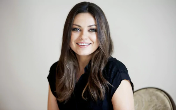 Portrait of celebrity Mila Kunis smiling, featured in a 4K Ultra HD PC desktop wallpaper and background.