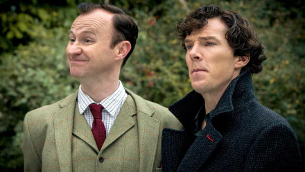 Two characters from the TV show Sherlock stand together against a green backdrop, with one looking slightly amused while the other appears contemplative. HD PC desktop wallpaper.