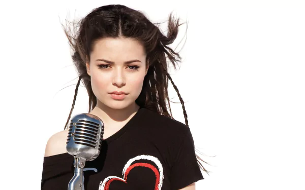 HD PC desktop wallpaper featuring celebrity Miranda Cosgrove with braided hair, a vintage microphone, and a black shirt with a heart design against a white background.