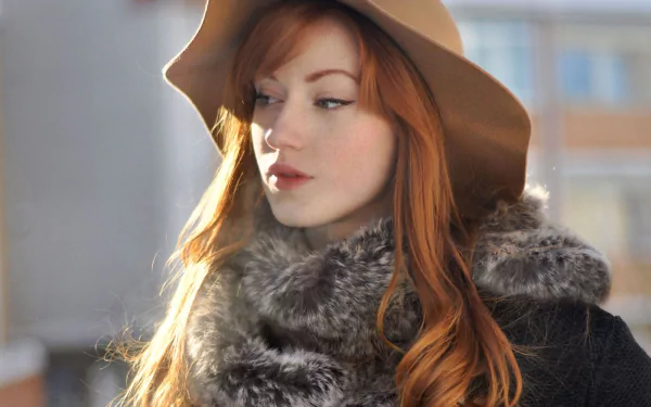 Red-haired woman in a wide-brim hat and fur-collared coat, soft natural light — HD PC desktop wallpaper background.