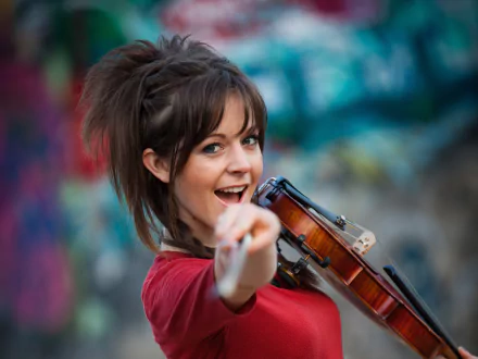 HD PC desktop wallpaper featuring musician Lindsey Stirling holding a violin, set against a vibrant, colorful background.