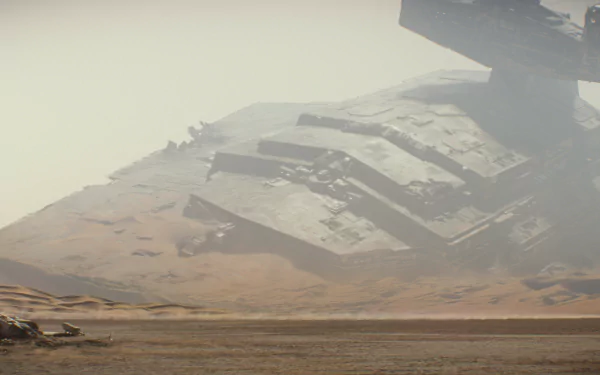 A dramatic HD wallpaper from Star Wars Episode VII: The Force Awakens, featuring an imposing, weathered starship looming over a sandy landscape.