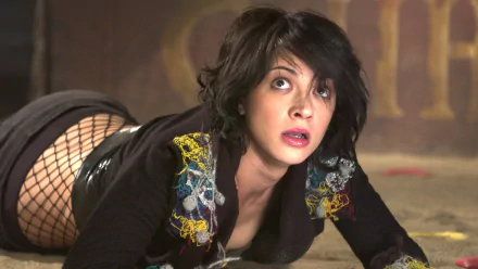 A scene featuring Asia Argento from the movie Land of the Dead, showcasing her in a dramatic pose. This HD wallpaper captures the intensity of the film's atmosphere.