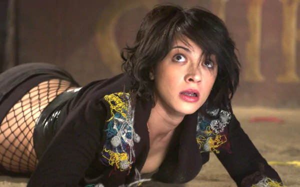 A scene featuring Asia Argento from the movie Land of the Dead, showcasing her in a dramatic pose. This HD wallpaper captures the intensity of the film's atmosphere.