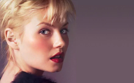 HD desktop wallpaper featuring a close-up portrait of celebrity Elisha Cuthbert with soft lighting and a neutral background.