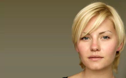 HD PC desktop wallpaper featuring a close-up portrait of celebrity Elisha Cuthbert with a neutral beige background.