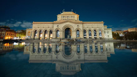 Night view of the National Gallery of Armenia, showcasing its grand architecture reflected in a calm pool, captured in stunning 4K Ultra HD quality.
