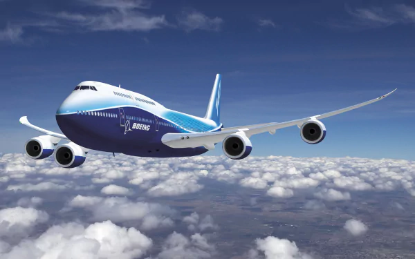 A Boeing 747 passenger plane soars above fluffy clouds, showcasing a vibrant design in an HD desktop wallpaper, ideal for aviation enthusiasts and desktop backgrounds.