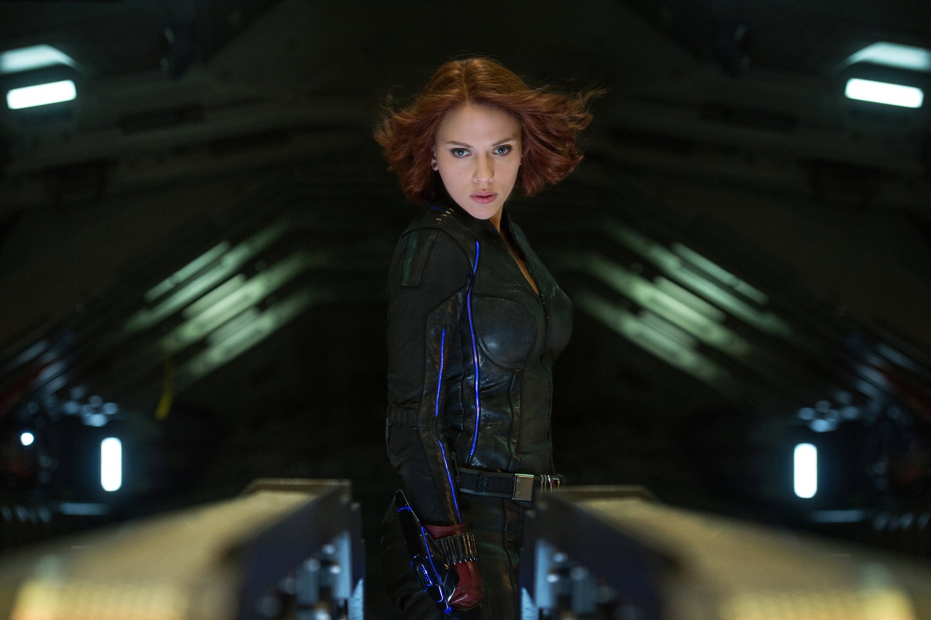 Scarlett Johansson as Black Widow in a dynamic pose from Avengers: Age of Ultron, showcased as a stunning 4K Ultra HD wallpaper and background.