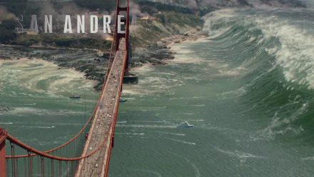 HD PC desktop wallpaper and background: movie still from San Andreas showing the Golden Gate Bridge packed with cars as a towering tsunami wave looms over the bay.