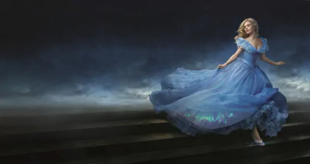 Lily James as Cinderella in a stunning blue gown, captured in an enchanting moment from the 2015 movie, set against a dramatic, ethereal backdrop. 8K Ultra HD wallpaper.