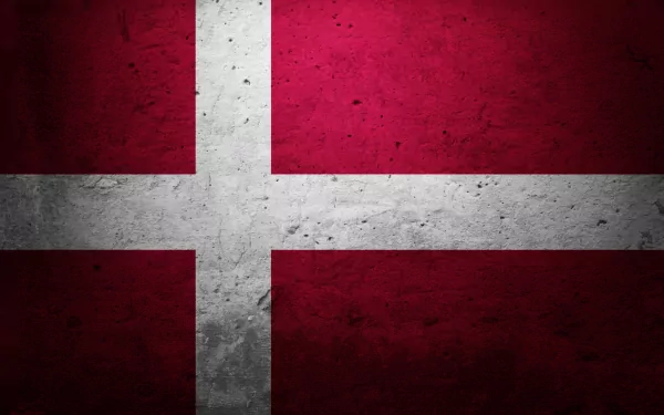HD desktop wallpaper featuring the flag of Denmark, showcasing its iconic red background with a prominent white cross pattern.