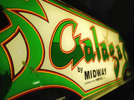 Retro Galaga arcade marquee by Midway in green and yellow, rendered as a 2K Quad HD PC desktop wallpaper and background.