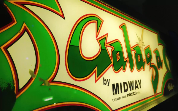 Retro Galaga arcade marquee by Midway in green and yellow, rendered as a 2K Quad HD PC desktop wallpaper and background.