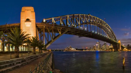 Night view of Sydney Harbour featuring the Sydney Harbour Bridge, Sydney Opera House, and Lavender Bay in Australia, captured in a high-definition desktop wallpaper.
