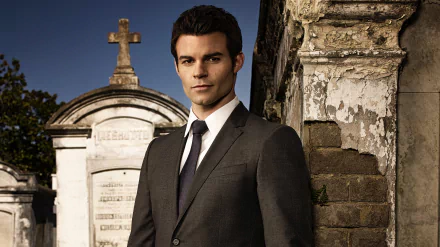 4K Ultra HD desktop wallpaper featuring a character from the TV show The Originals, standing in a graveyard with a stone cross and weathered tombstones in the background.