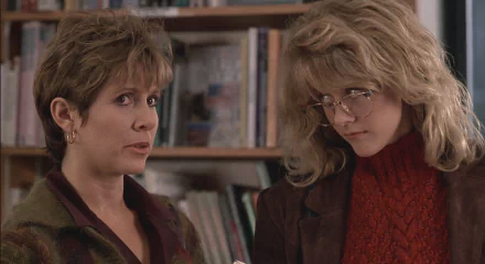 Carrie Fisher and Meg Ryan in a scene from the movie *When Harry Met Sally...*. The image serves as a HD desktop wallpaper and background, showcasing a memorable moment between the characters.