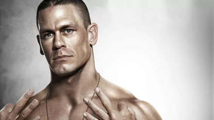 HD desktop wallpaper featuring WWE wrestler John Cena posing with a focused expression against a grunge textured background.