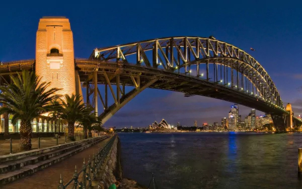 Night view of Sydney Harbour featuring the Sydney Harbour Bridge, Sydney Opera House, and Lavender Bay in Australia, captured in a high-definition desktop wallpaper.