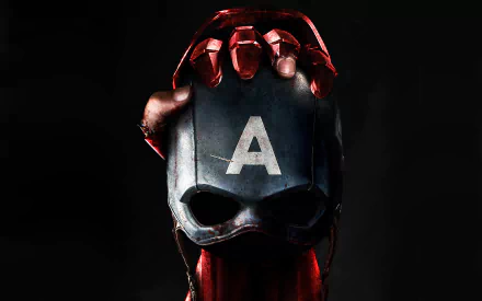 HD desktop wallpaper featuring a scene from Captain America: Civil War with Iron Man's gauntlet holding Captain America's helmet contrasted against a dark background.