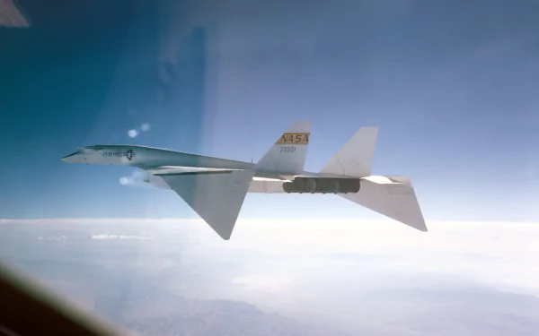 North American XB-70 Valkyrie aircraft soaring above clouds, showcasing its sleek design in this 4K Ultra HD Air Force and NASA military-themed desktop wallpaper.