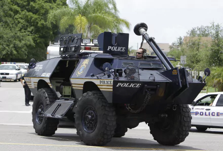 A Cadillac Gage armored personnel carrier, designed for military and police use, captured in a dynamic HD scene, showcasing its robust design and tactical features.