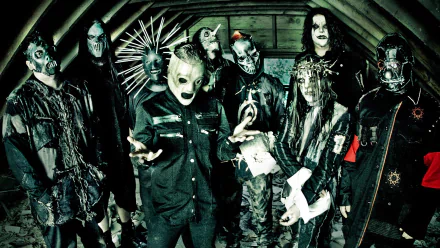 HD wallpaper featuring the band Slipknot, known for their heavy metal, industrial metal, and nu metal styles, captured in a dramatic, dark-themed setting.