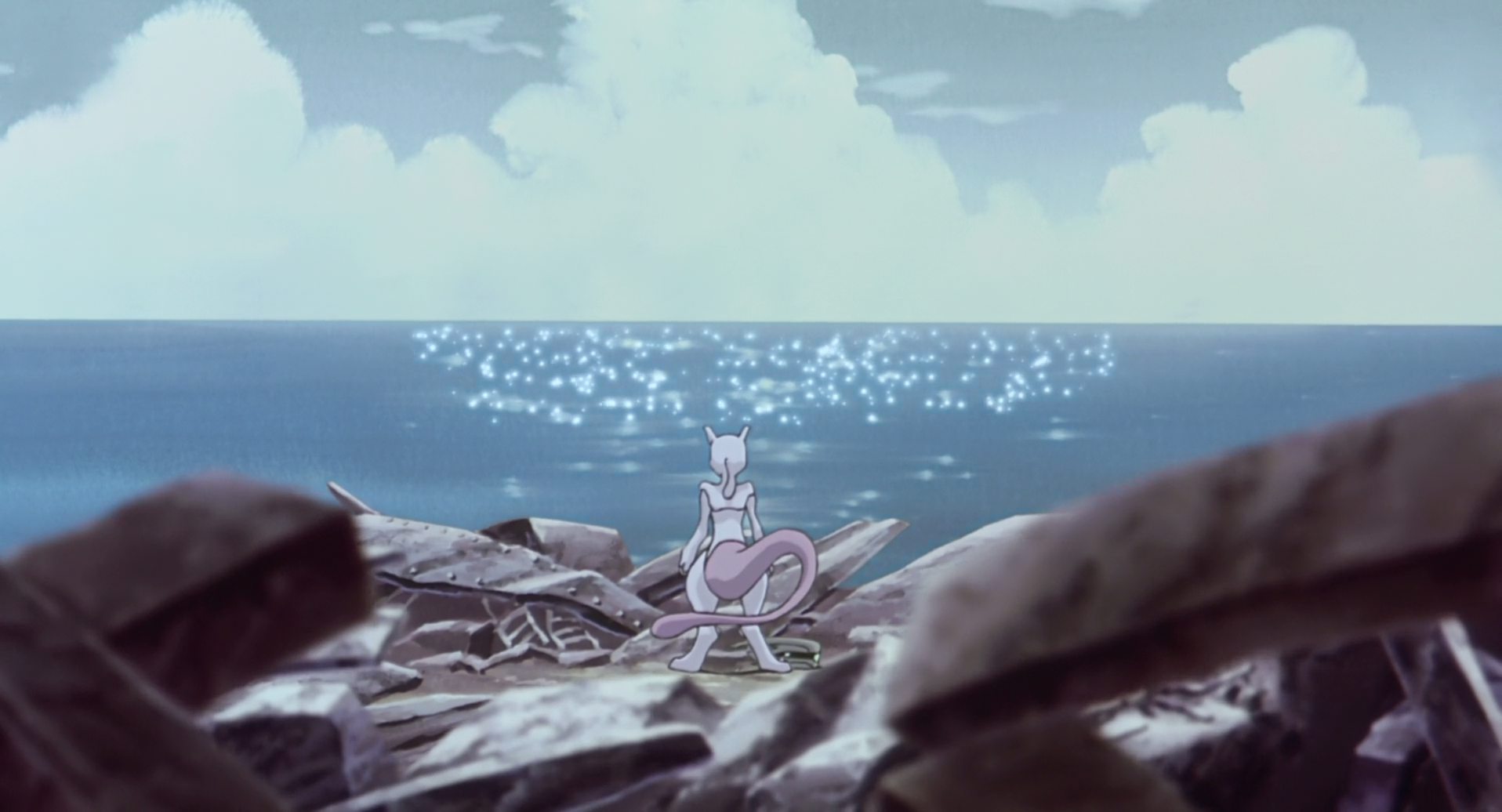 HD PC desktop wallpaper from Pokémon: The First Movie featuring Mewtwo standing on rocky shore, gazing at sparkling ocean under a cloudy sky in anime style.