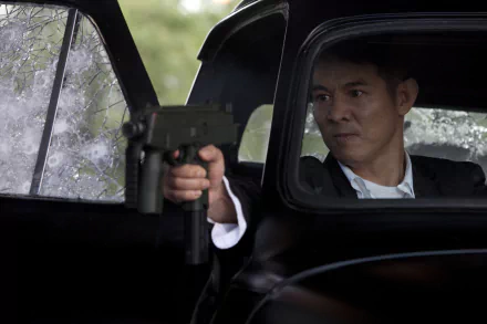 Jet Li as Yin Yang in a scene from *The Expendables*, holding a gun from inside a car, featuring intense action amidst shattered glass. 4K Ultra HD wallpaper for desktop.