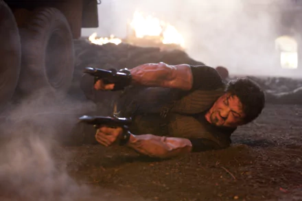 Sylvester Stallone as Barney Ross in a dynamic action scene from *The Expendables*, featuring intense combat and dramatic lighting. Ideal 4K Ultra HD desktop wallpaper.