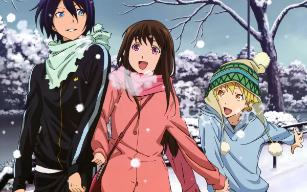 HD desktop wallpaper featuring Hiyori Iki, Yukine, and Yato from the anime Noragami, enjoying a snowy day with happy expressions and winter clothes.