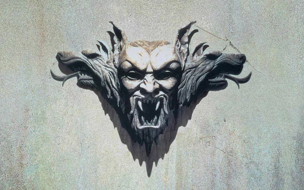 HD PC desktop wallpaper featuring a dramatic three-headed stone sculpture inspired by the movie Dracula (1992).